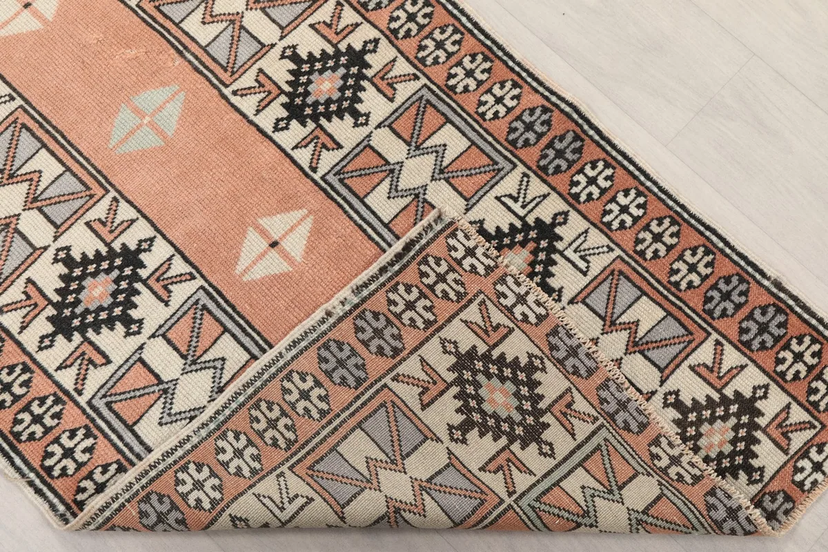 View of the runner's texture and pile as it is folded, showing the back of the rug