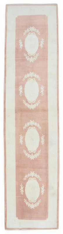 Full overhead view of the 3x13 rose and ivory floral medallion runner rug on a white background