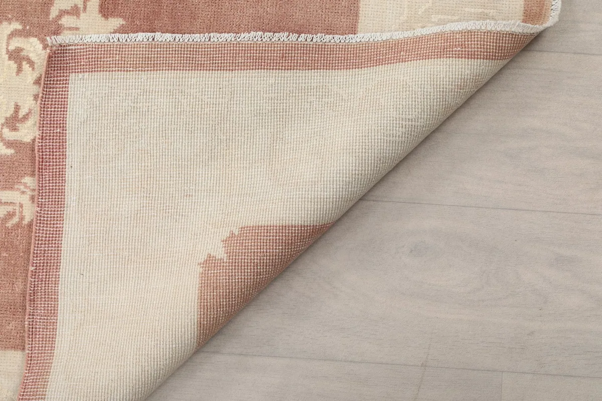 Angled view showing the reverse side of the runner rug, demonstrating its construction and edges