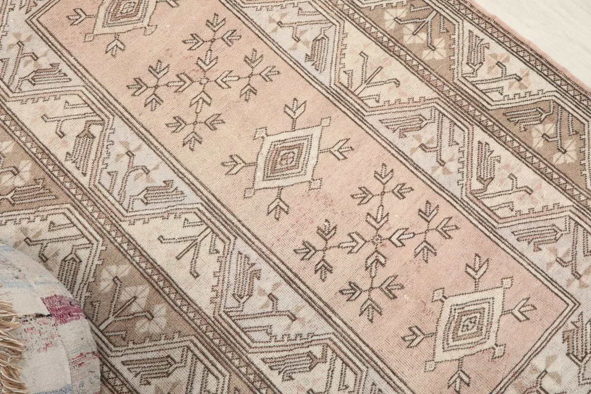 Angled overhead view highlighting the central rose field and tribal motifs