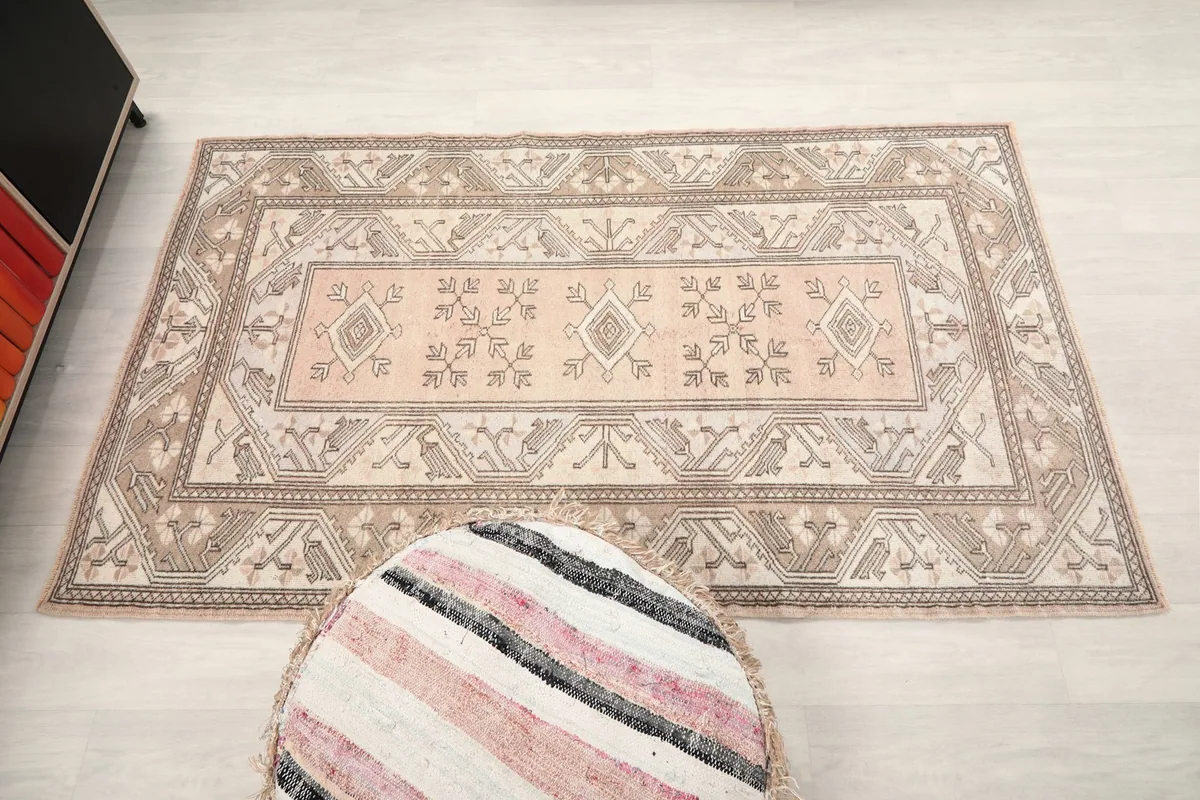 Overhead shot of the rug in a room, emphasizing its rectangular shape and design