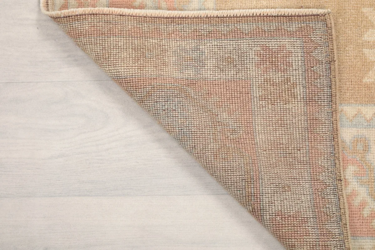 Close-up of the back of the rug, showing the dense hand-knotting and material quality