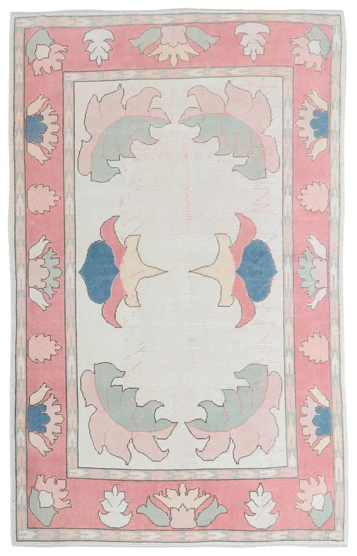 Full overhead view of the rose and ivory floral vintage Anatolian rug