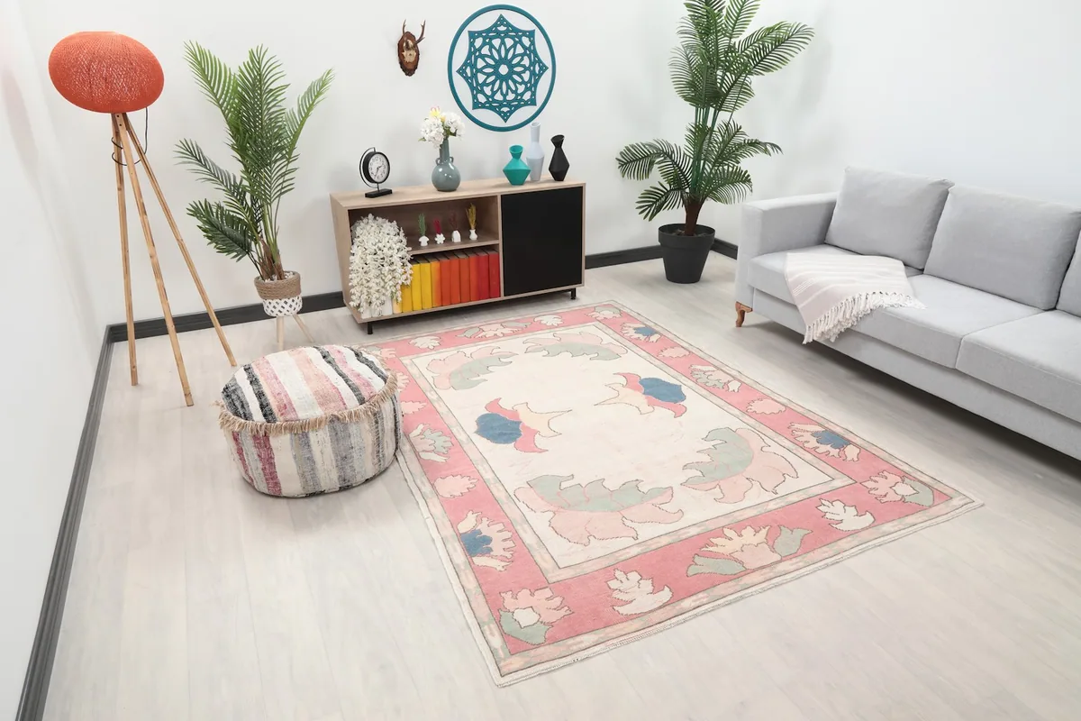 Angled view of the vintage floral rug in a light-filled living space