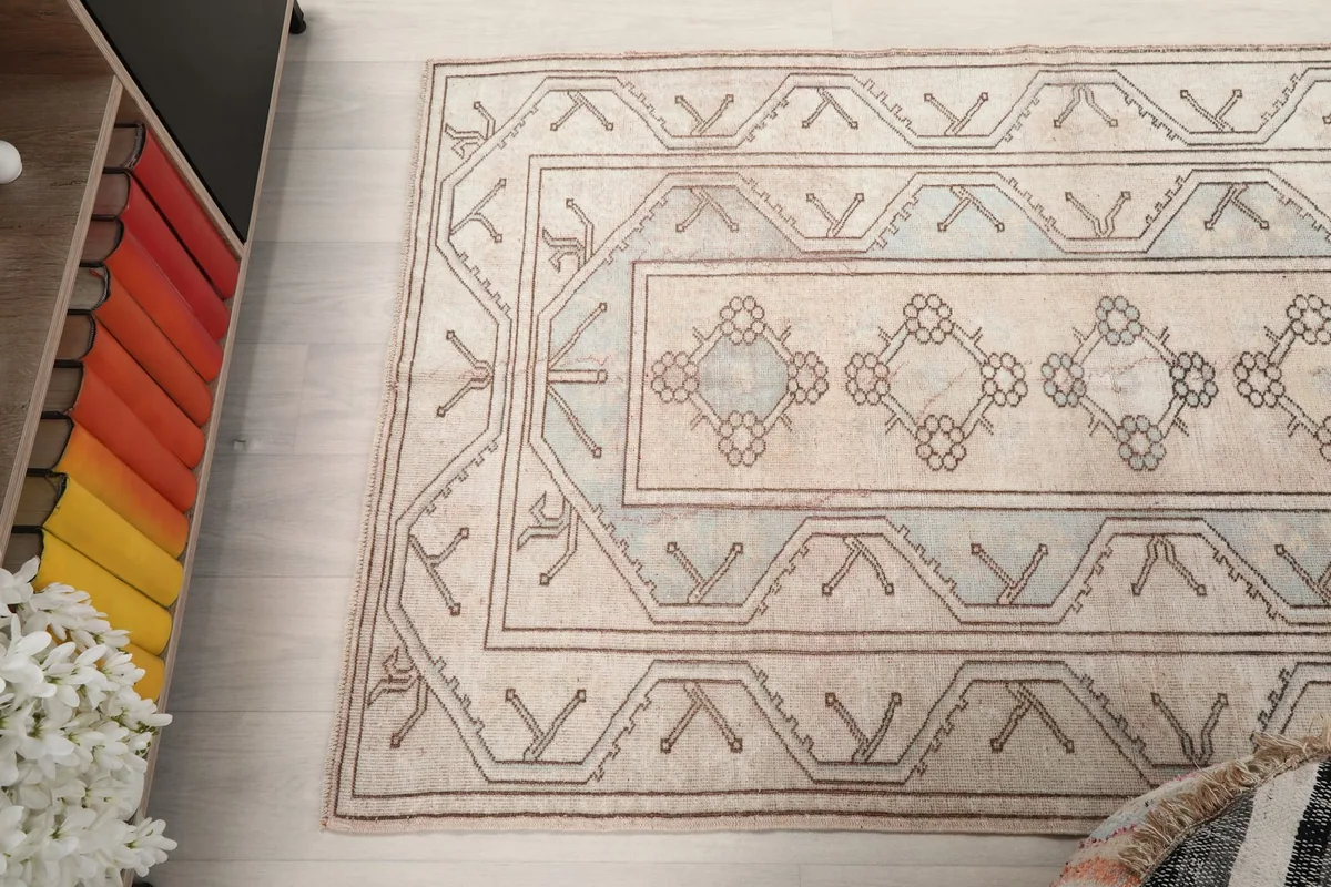 Overhead view of the rug, capturing the full pattern from above within the room.