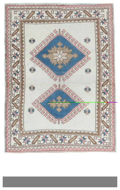 Full top view of the ivory, blue, and pink geometric vintage Anatolian rug