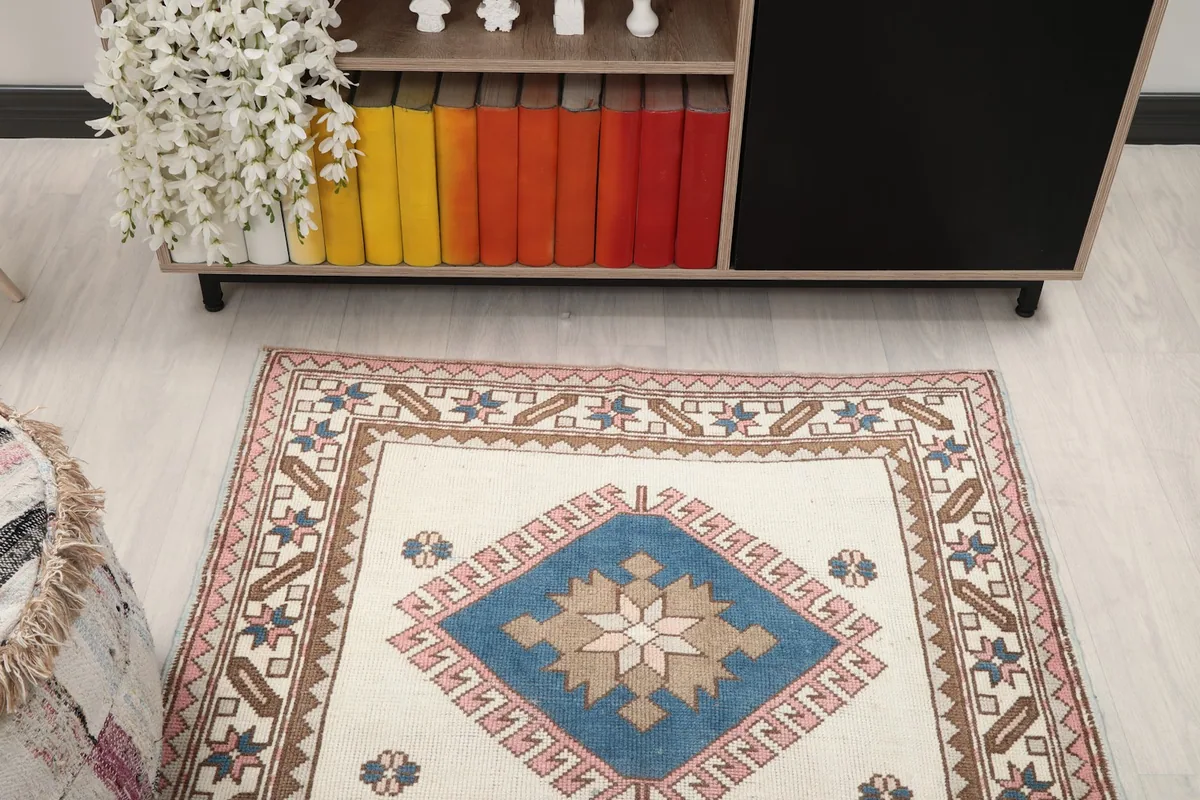 Overhead view of the rug in a room setting, showing its full design and colors