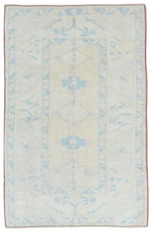 Full top view of the 3'11" x 6'0" ivory and blue vintage Anatolian rug on a white background.