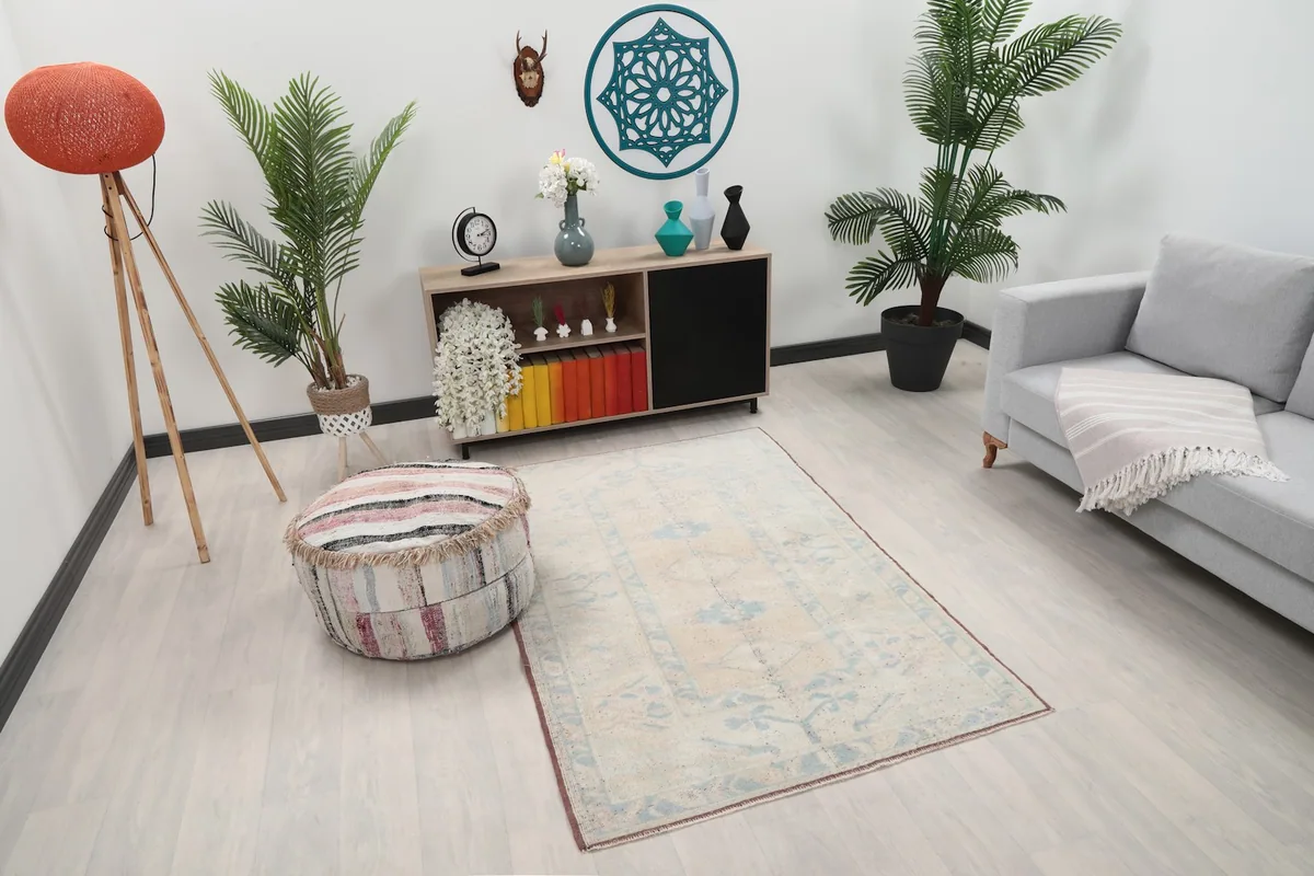 Overhead view of the rug placed in a room, showing its full design and scale relative to furniture.