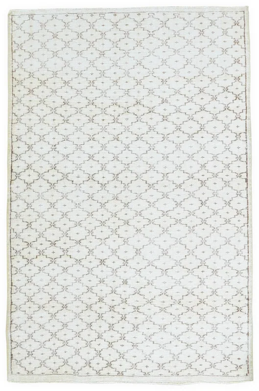 Full overhead view of the 5x8 vintage Anatolian rug with geometric brown pattern on a cream field