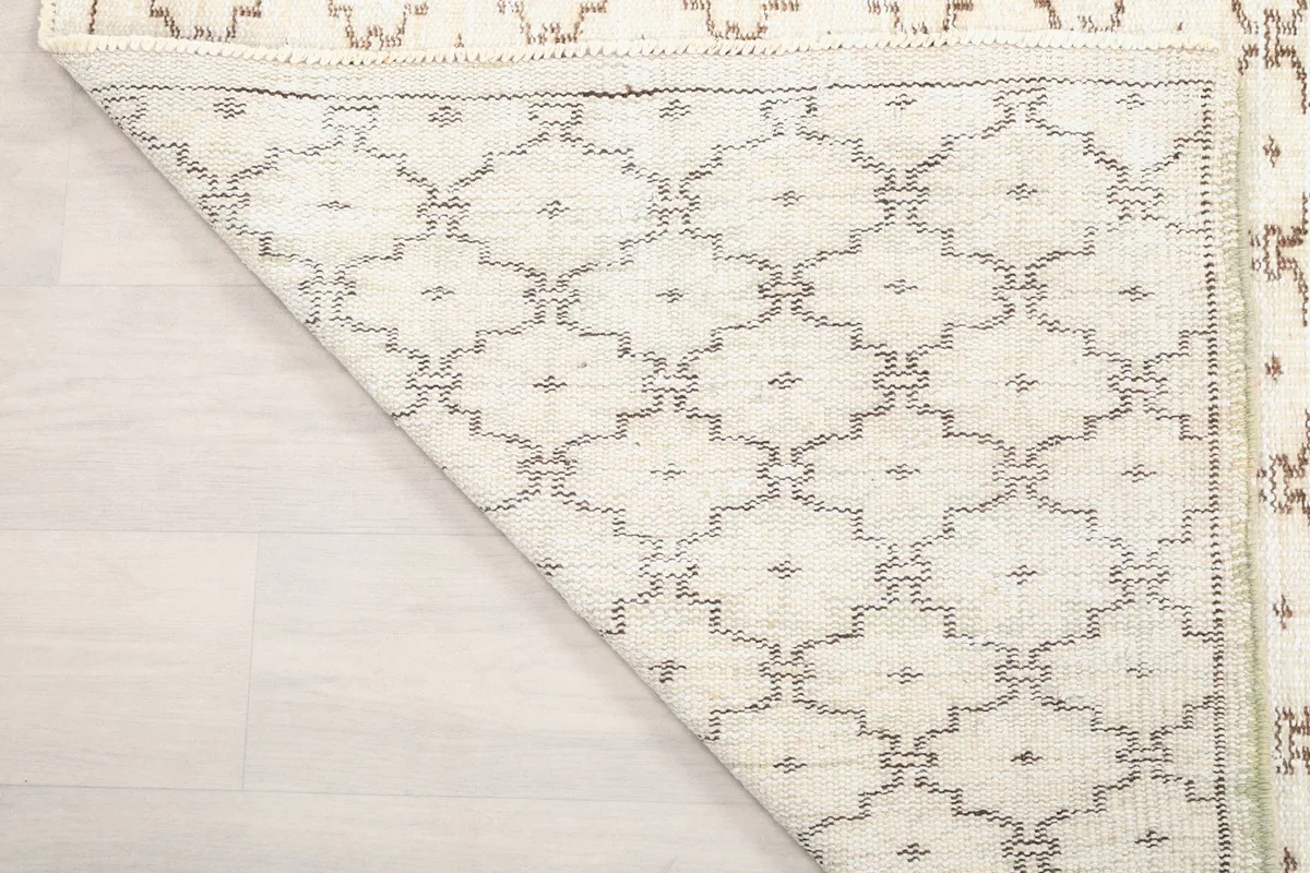 Close-up of the back of the rug, revealing the knotting and material quality