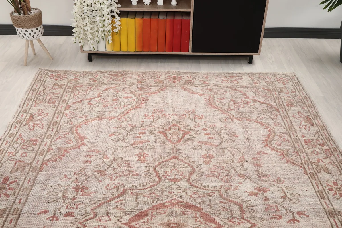 Overhead view focusing on the upper half of the rug, showcasing the medallion and field patterns