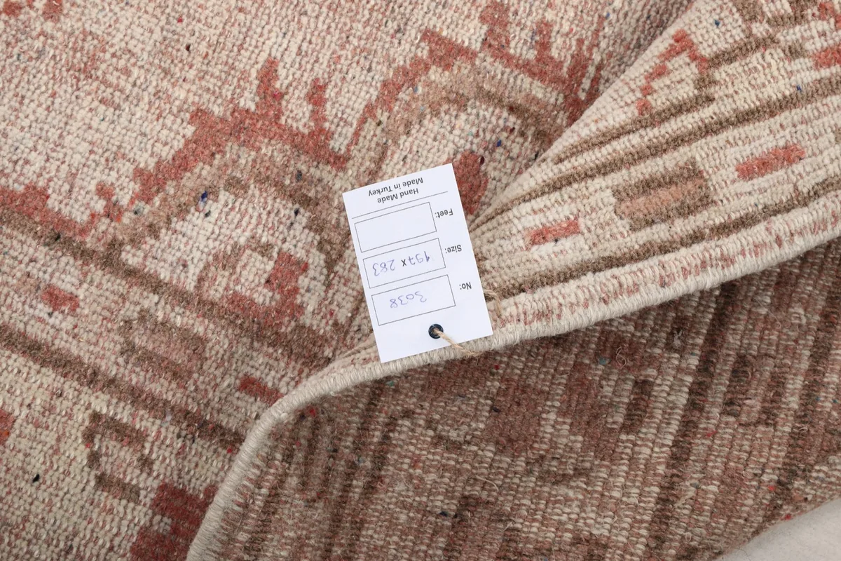 Detail of the rug's back and pile texture with a label indicating origin and material