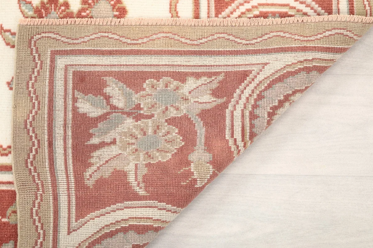 Another view of the folded rug corner, showing the craftsmanship of the back