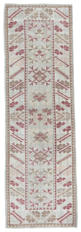Full overhead view of the vintage Anatolian runner rug on a white background