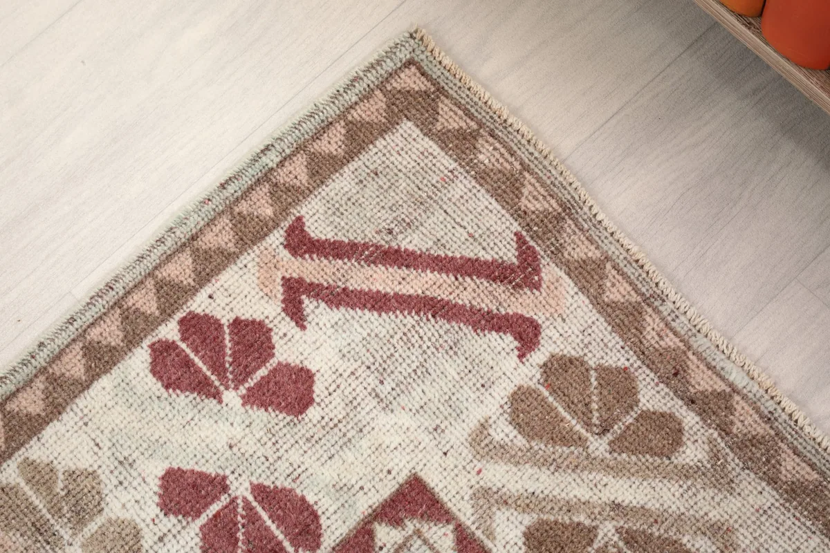 Detail of the rug's border design and a corner motif