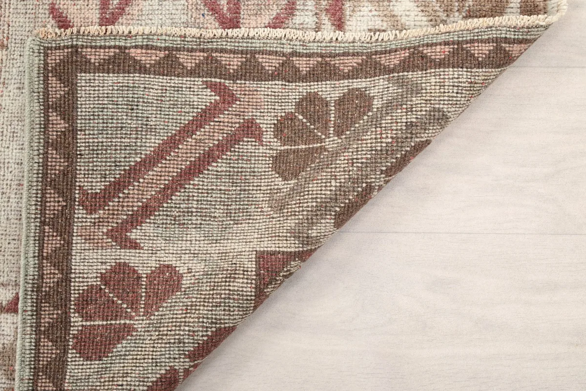 Underside view of the rug, showing the knotting and construction