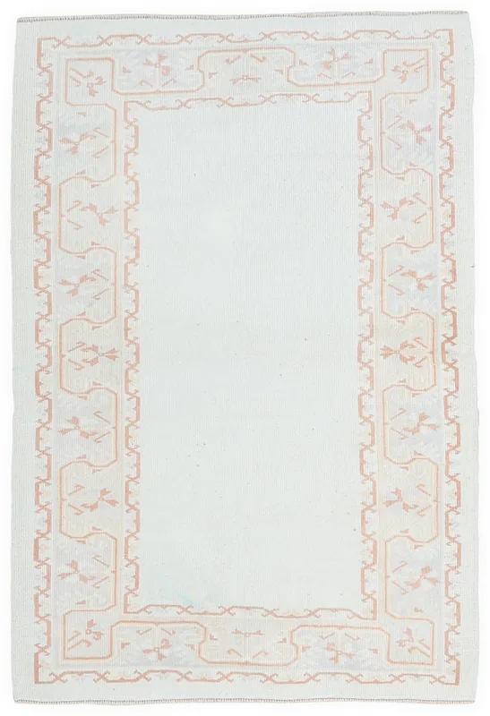 Full top view of the ivory and rose vintage Anatolian area rug