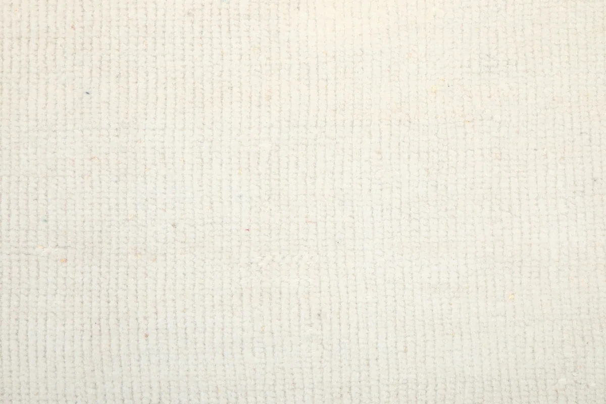 Close-up texture of the hand-knotted wool pile showing its low height