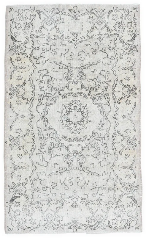 Full top view of the ivory and charcoal vintage Anatolian rug with medallion pattern
