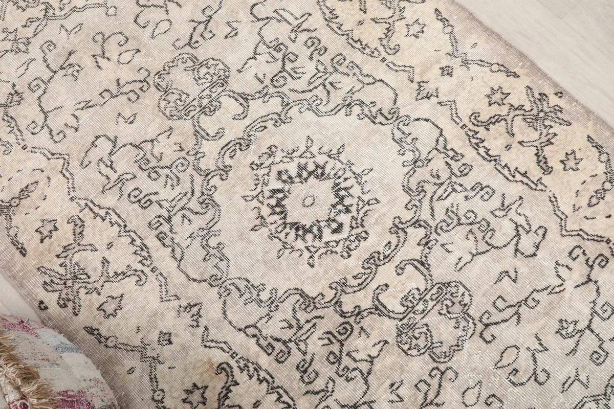 Detail view of the central medallion and surrounding floral motifs