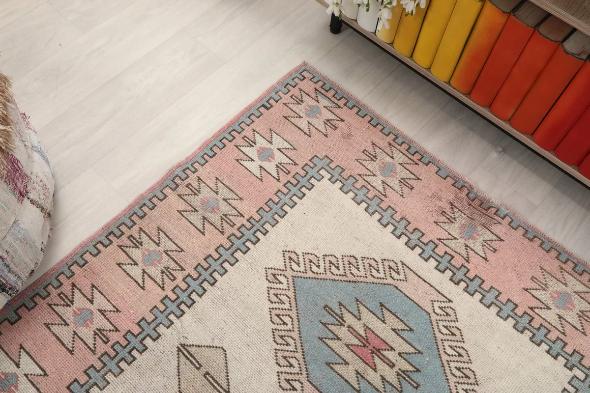 Angled view focusing on the rug's top half, showcasing the border and field design