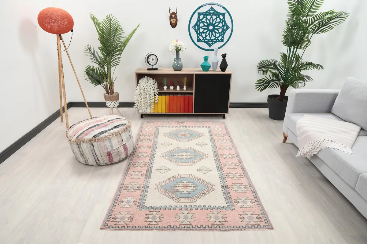 Vintage Anatolian rug displayed in a living room setting with light furniture