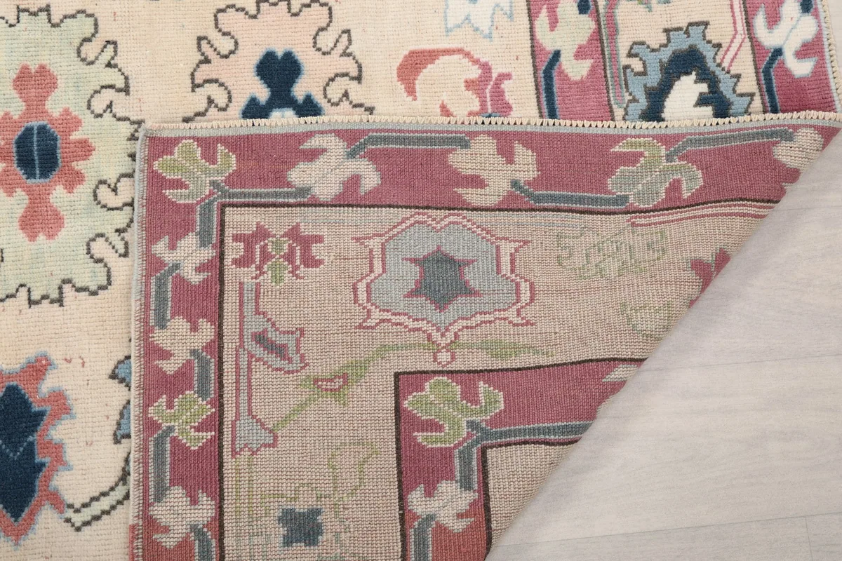 Close-up of the back of the rug, showing the cotton foundation and hand-knotted construction.
