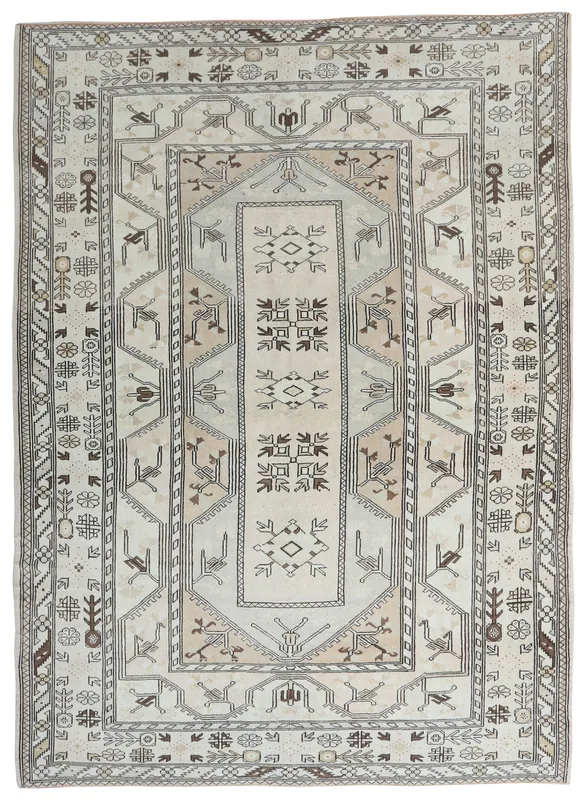 Full overhead view of the 6'8" x 9'3" vintage Anatolian rug with ivory and beige geometric patterns