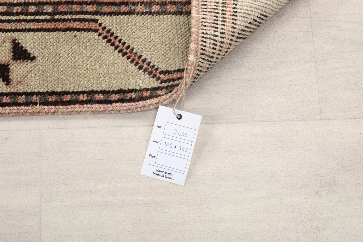 Size tag attached to the back of the vintage Anatolian runner rug.