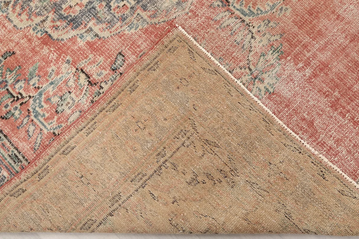 Underside of the hand-knotted rug, revealing the cotton foundation and construction