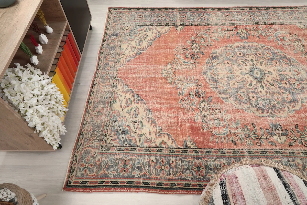 Overhead view of the rug's full pattern and color variations, including the rose field and gray medallion