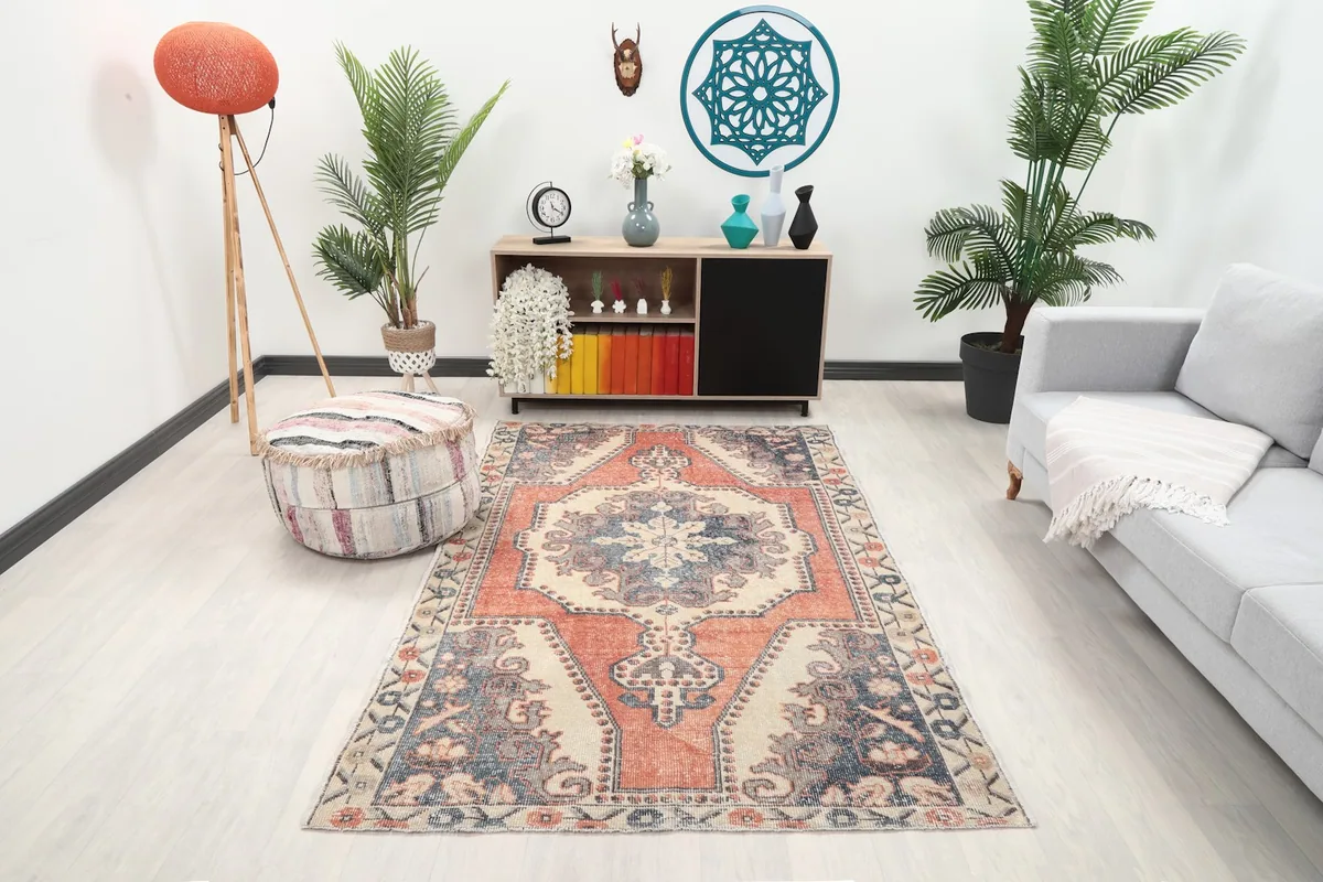 Vintage rust and navy rug showcased in a modern living room setting