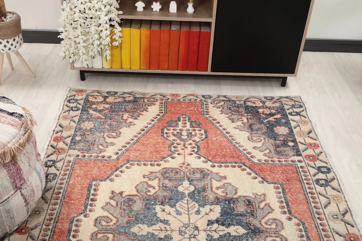 View of the rug in a living room, highlighting its colors and design