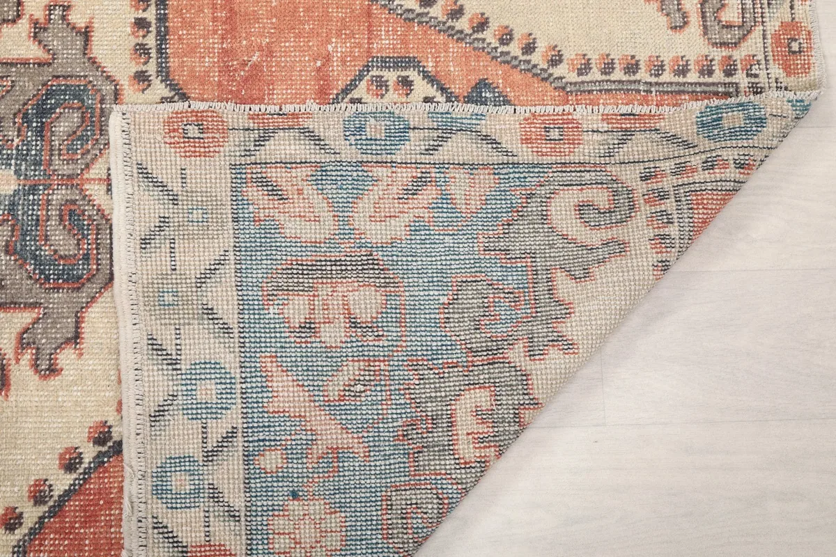 Close-up of the rug's reverse showing hand-knotted construction