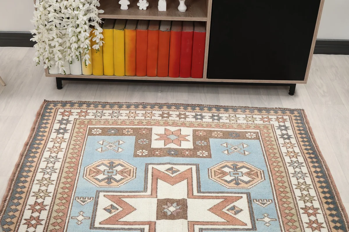 Overhead view of the rug in a room, emphasizing its placement under a console table