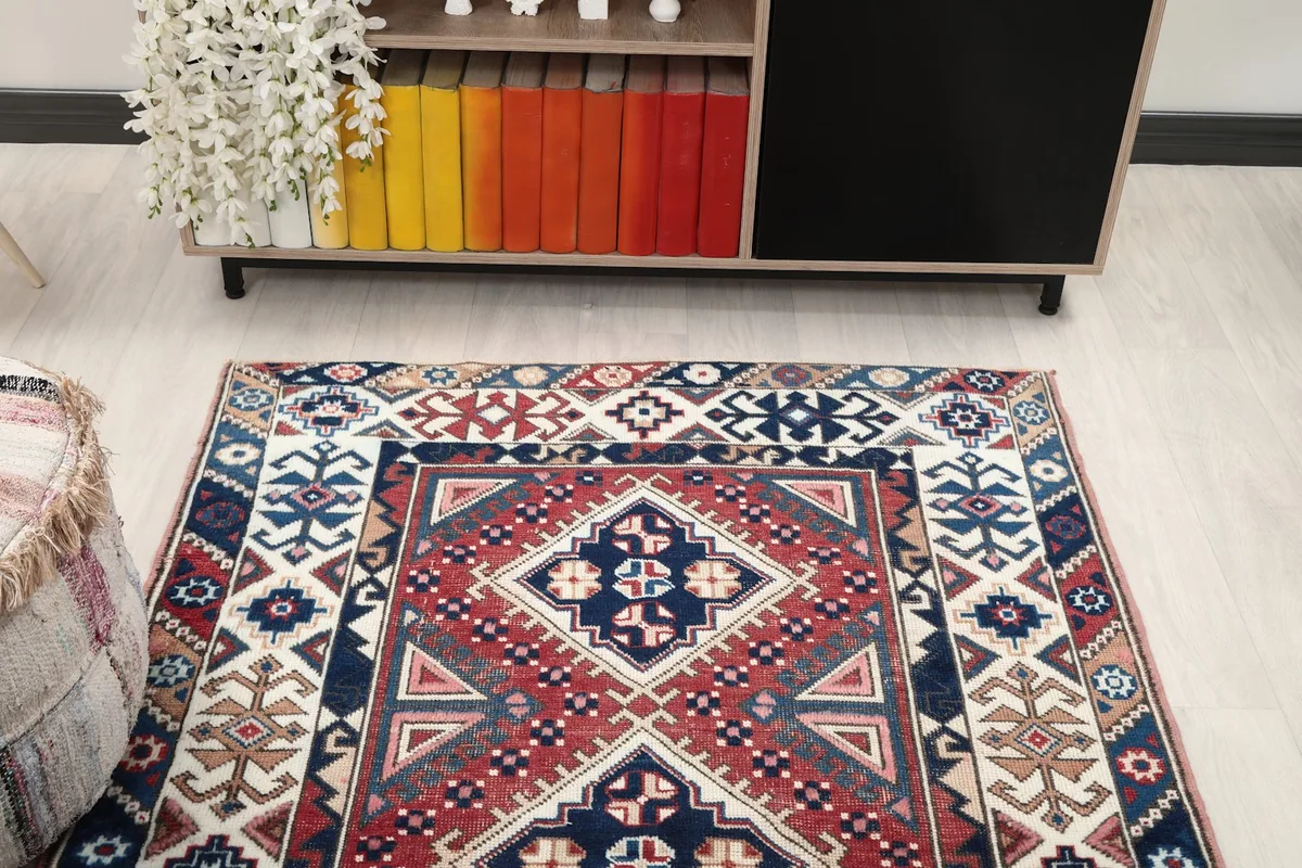 Overhead view of the rug's top half, showcasing the main geometric design and vibrant colors