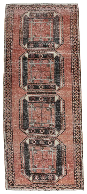 Full top view of the 4x11 rust and black geometric Anatolian runner on a white background.