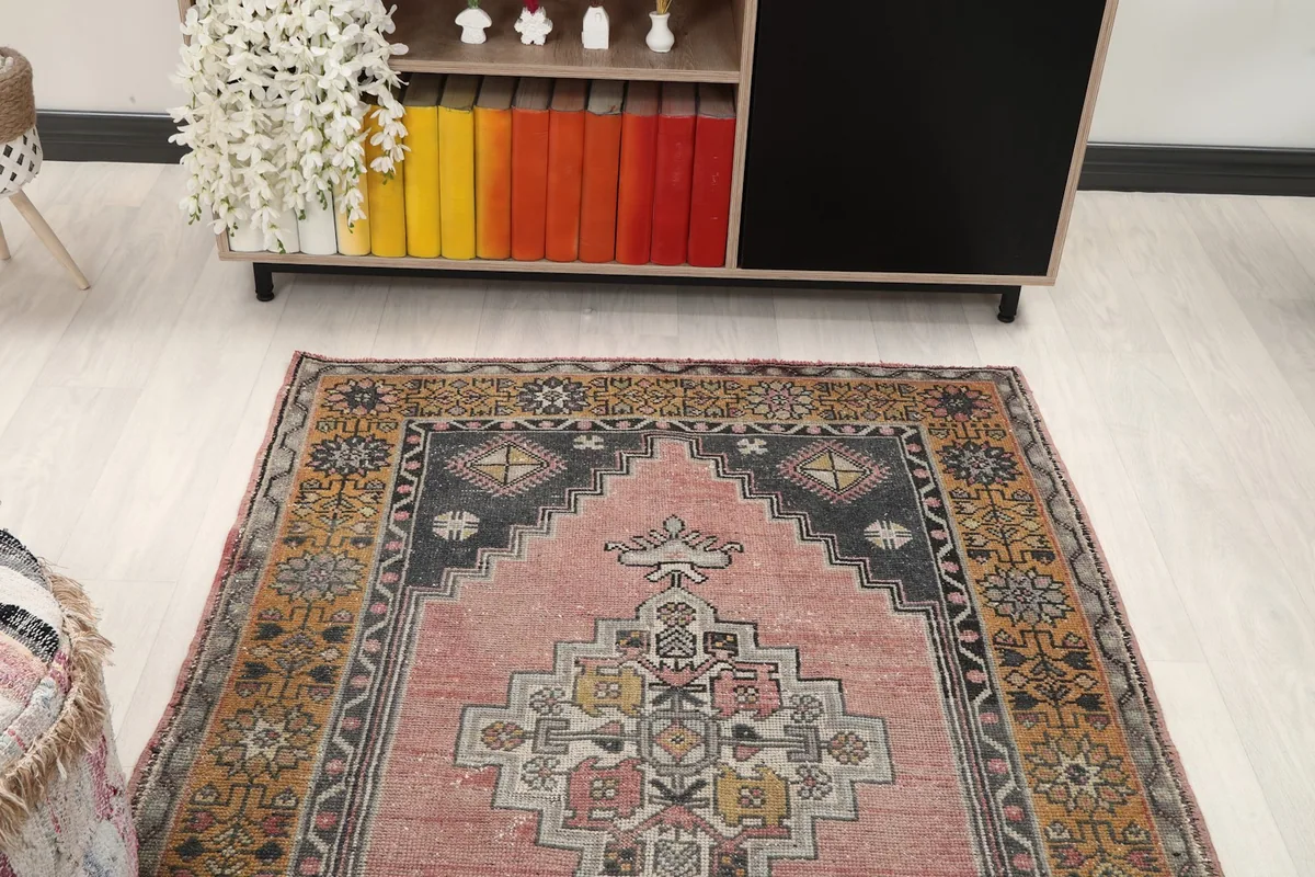 Overhead view of the rug in a room, focusing on its colors and patterns in relation to the decor.