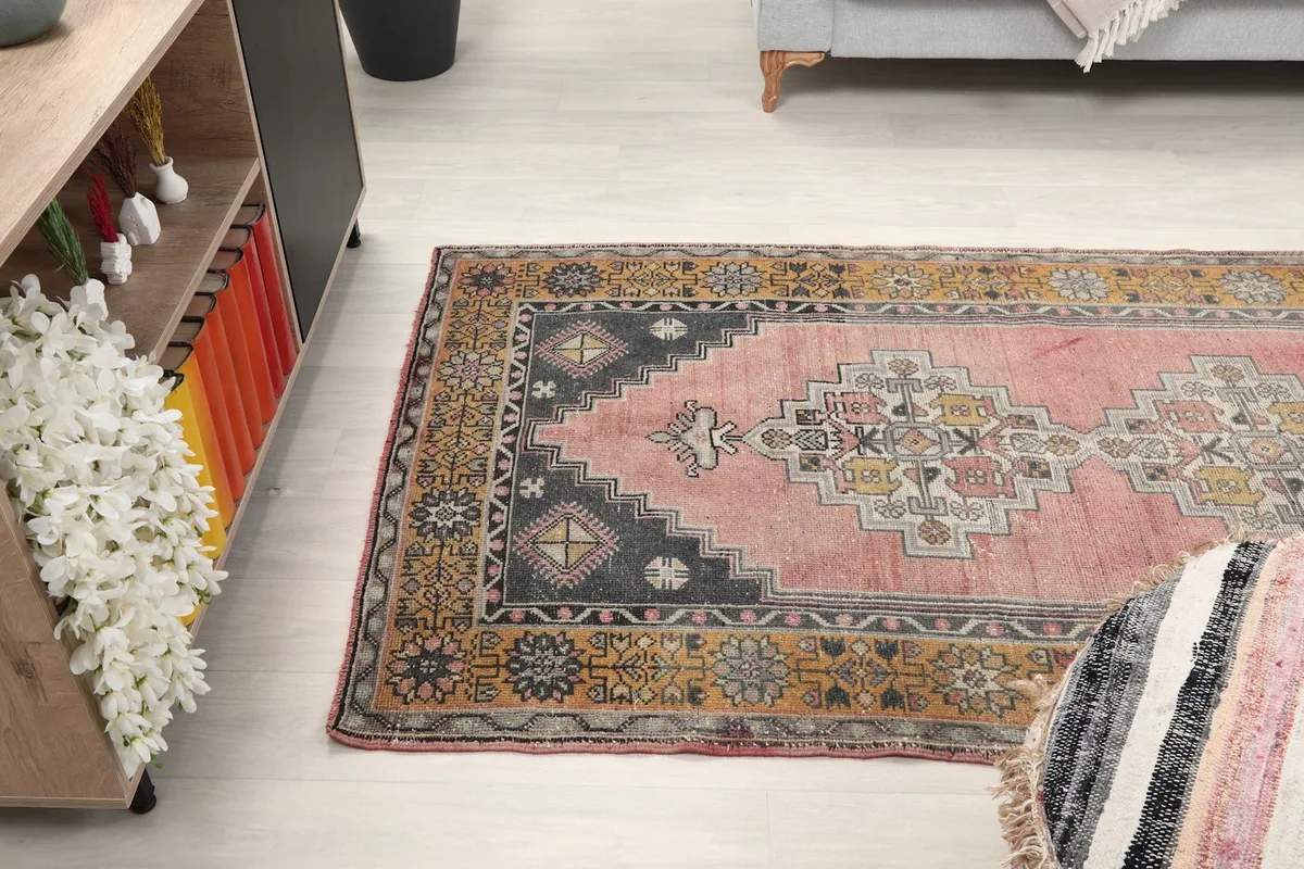 Wide angle view of the rug in a room setting, capturing its overall presence and dimensions.