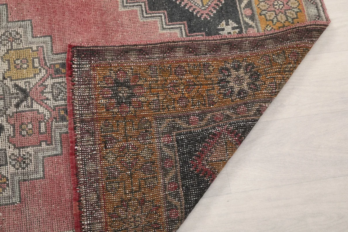 Close-up of the reverse side of the rug, detailing the knots and foundation structure.