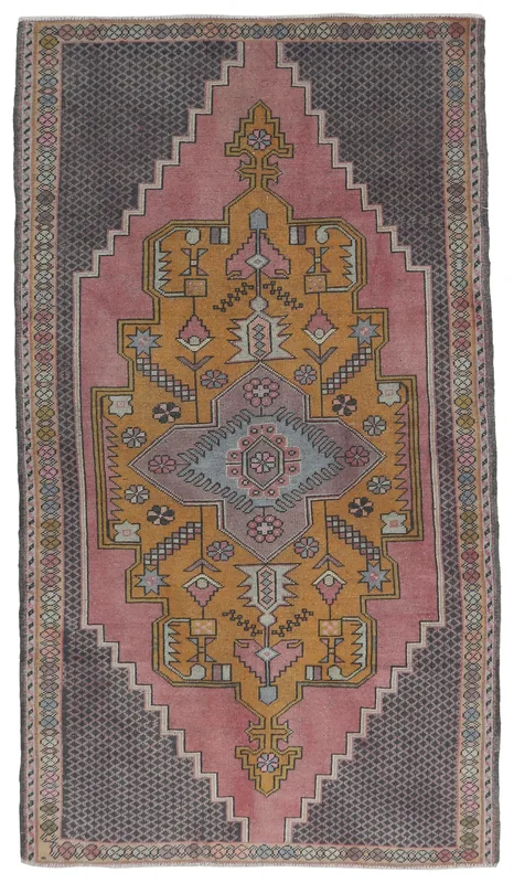 Top view of a vintage Anatolian rug with a rose field, gold medallion, and charcoal border