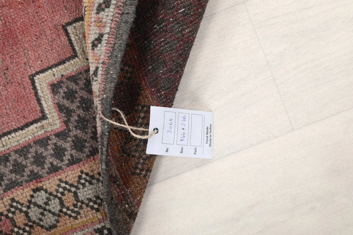 Detail of the rug with a product tag displaying size and item number