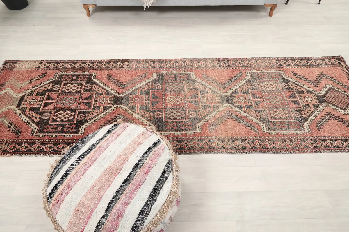 Full length view of the 3'3" x 10'6" vintage runner rug laid out in a room