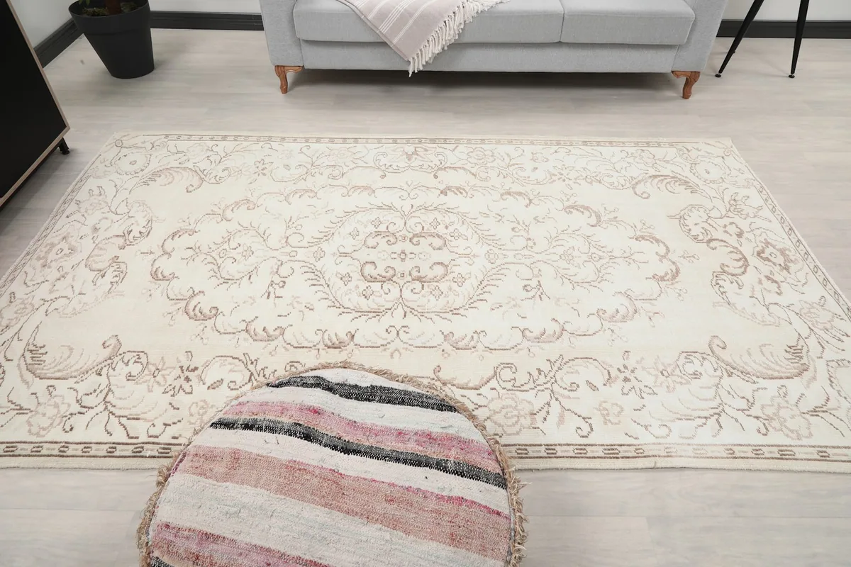 Direct overhead shot of the rug in a room setting, emphasizing its overall design and proportions