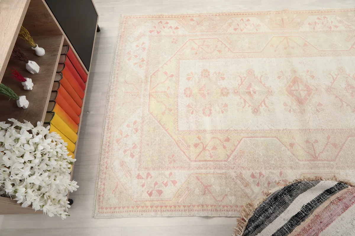 Overhead view of a section of the rug, capturing its soft colors and intricate design