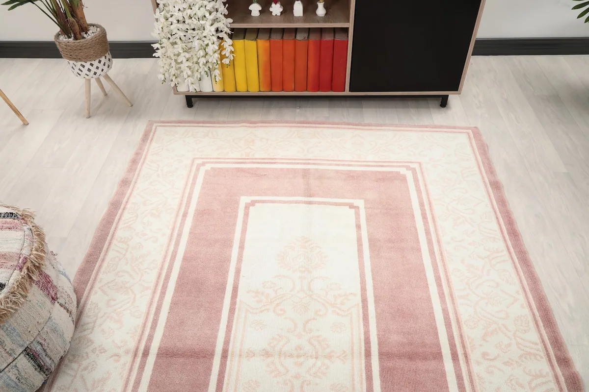 Overhead angle view of the rug from one end, showing its placement in the room