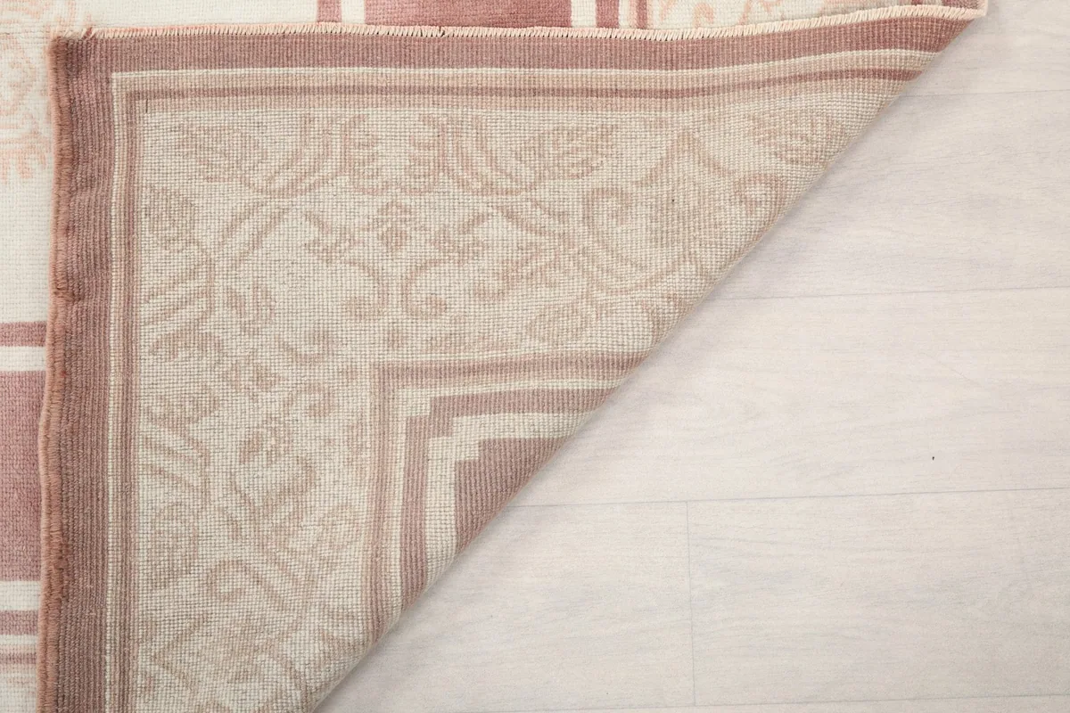 Underside of the rug's corner, showcasing the construction and foundation