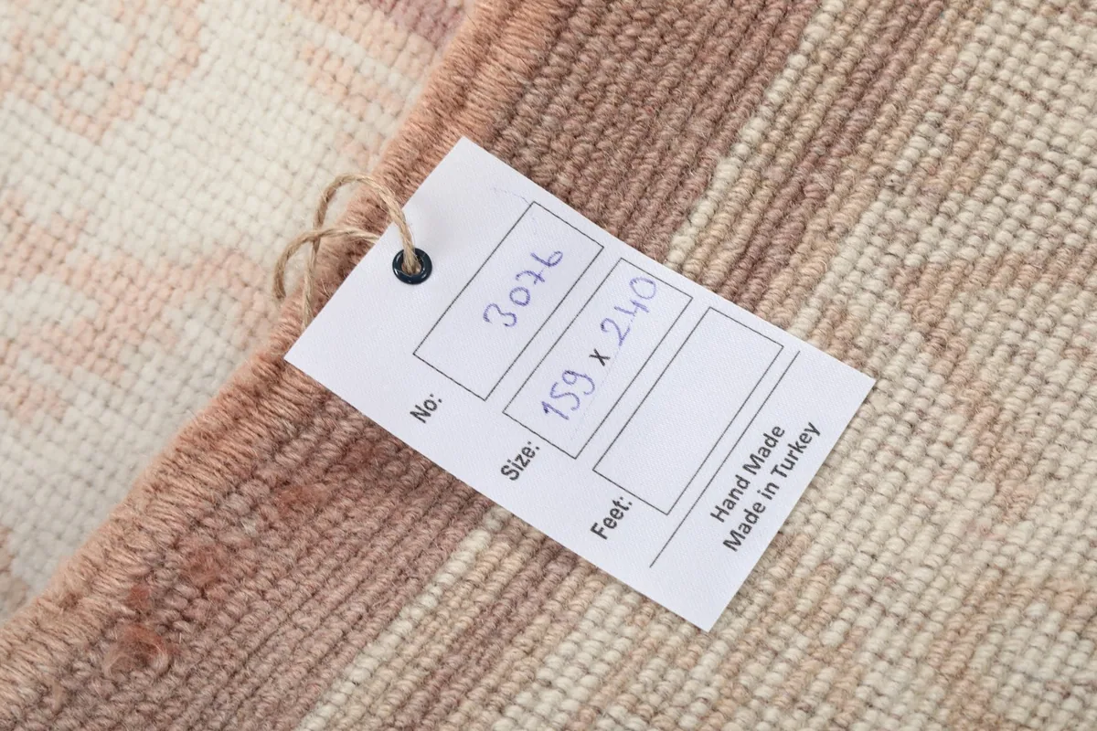 Product tag attached to the rug, showing item number and size in centimeters