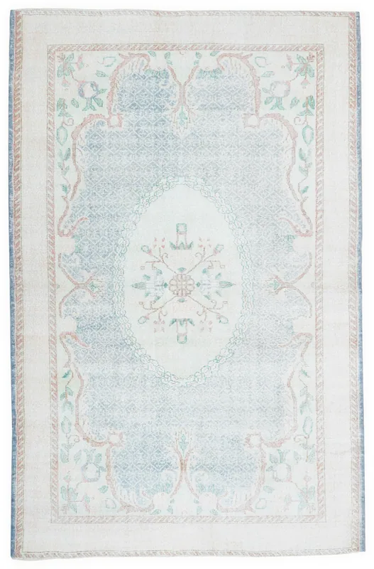 Full top view of the 6'5" x 10'0" vintage Anatolian area rug with an ivory border and blue field